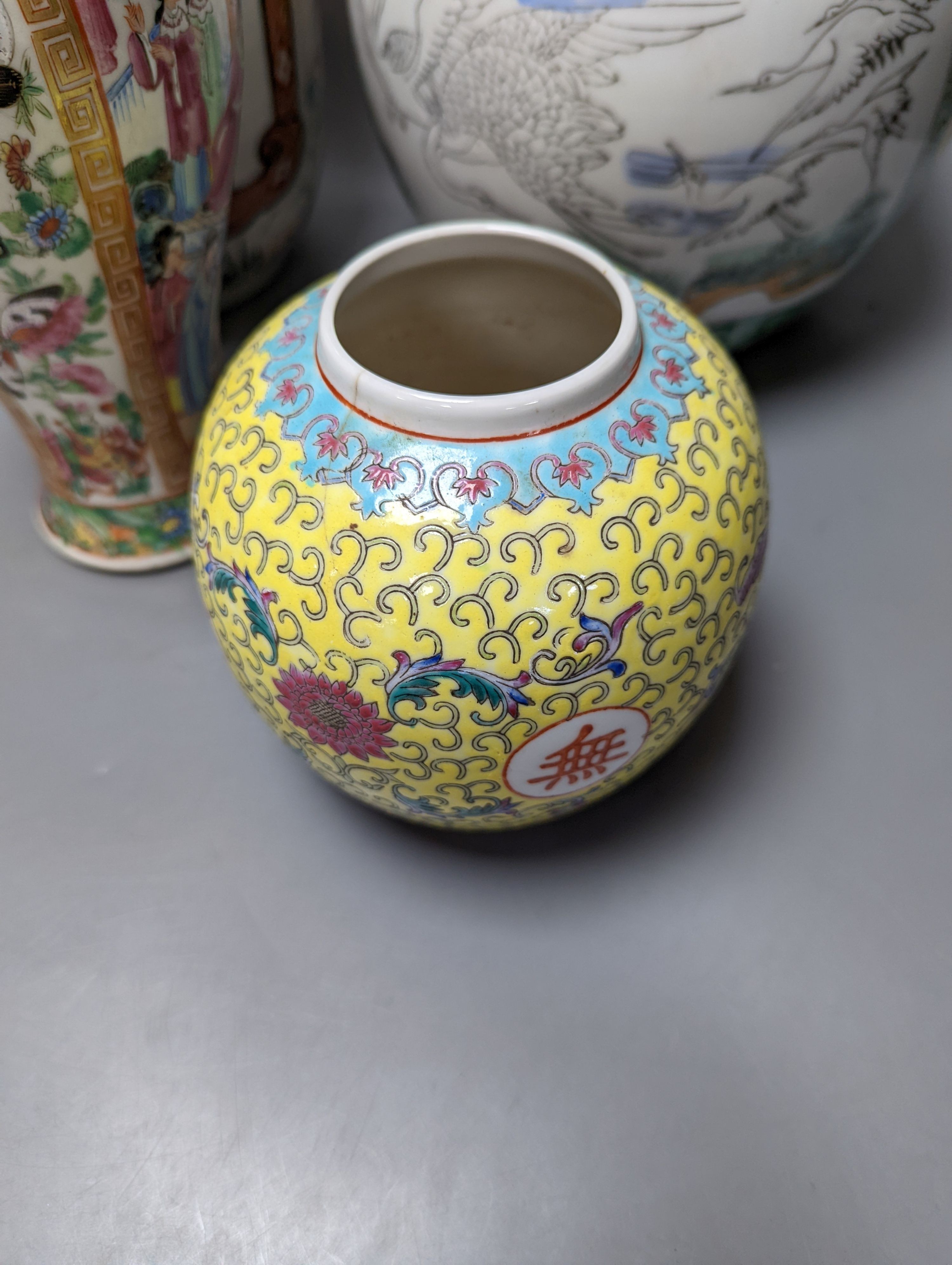 A Chinese famille rose vase and two ginger jars, together with a Japanese vase, 38cm